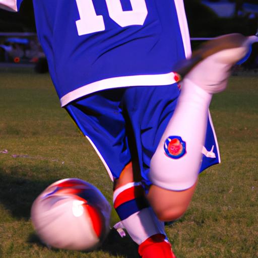 Chụp ảnh một cầu thủ bóng đá đang sút bóng, với biệt danh được in trên áo đấu của họ.