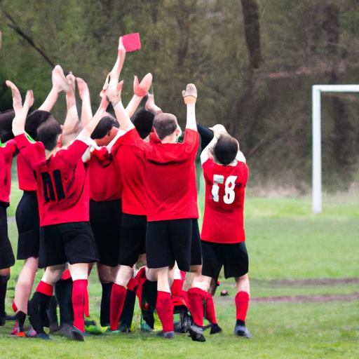 Đội bóng đá ăn mừng sau khi thắng trận đấu với số lượng thẻ đỏ cao